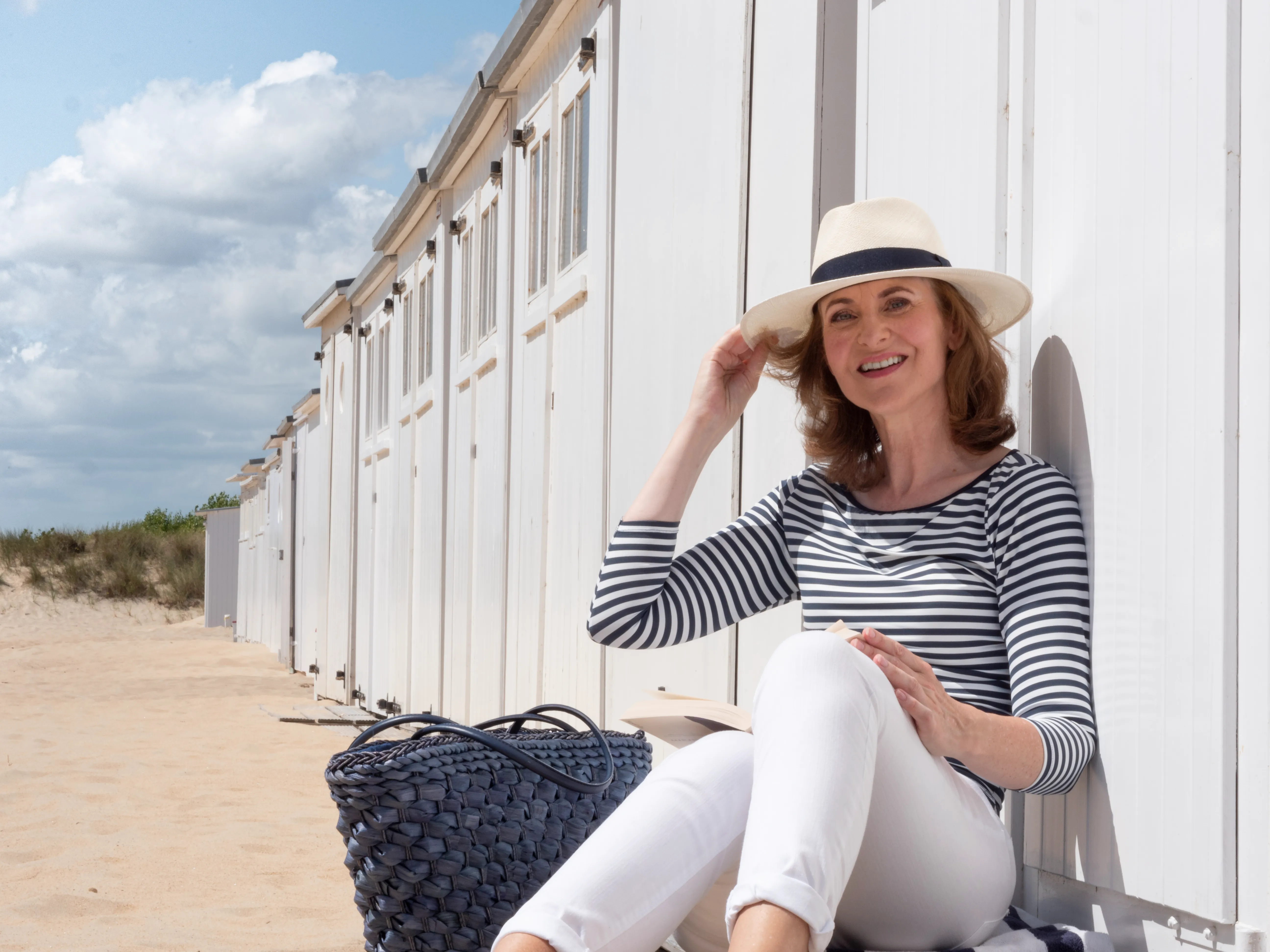 Happy woman, age 49, looking relaxed